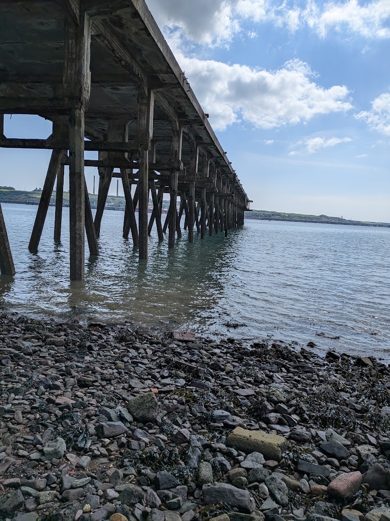 The old jetty at low tide on the West Wales coast